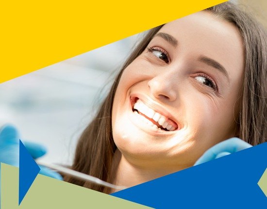 A woman is smiling receiving root canal treatment